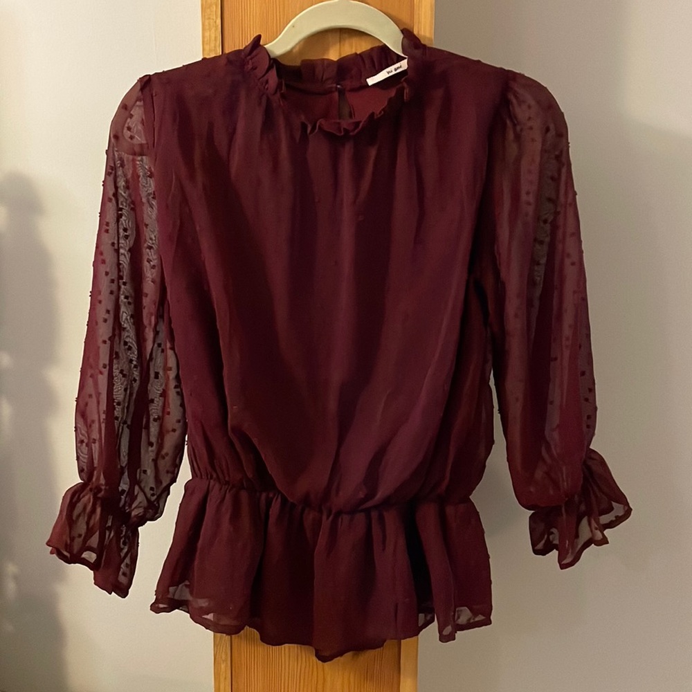 Maroon women’s blouse with appliqué
